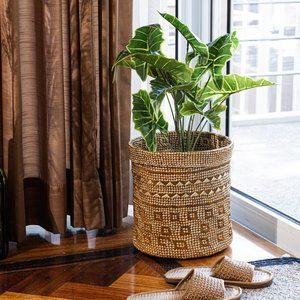 Hand woven colorful rattan seagrass planter in gold and brown or blue and purple